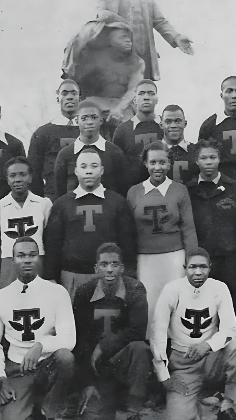 Photograph of Tuskegee University students from the 1920s -1930s wearing vintage varsity Tuskegee sweaters