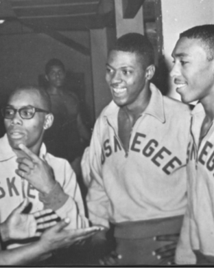 An archival photograph of a group of Tuskegee University students wearing a Tuskegee sweatshirt