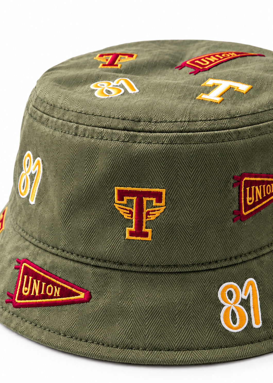 Close-up/detail: Close-up of embroidered archival patches on Tuskegee University cotton herringbone bucket ha